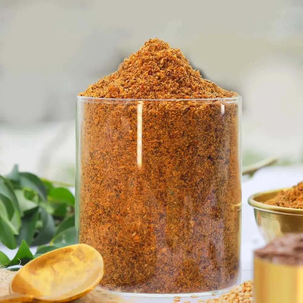 Glass container filled with flax seeds powder mix on a blurred natural background