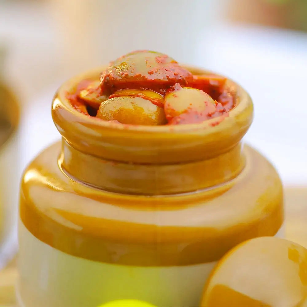Close up shot of jar of lemon pickle on a blurred background