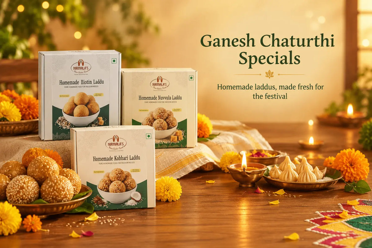 Three boxes of Ganesh Chaturthi Specials homemade laddoos arranged on a wooden table with lit diya candles, marigold flowers, and festive decorations. The packaging is cream and green, and the text on the right reads 'Ganesh Chaturthi Specials Homemade laddoos, made fresh for the festival'.