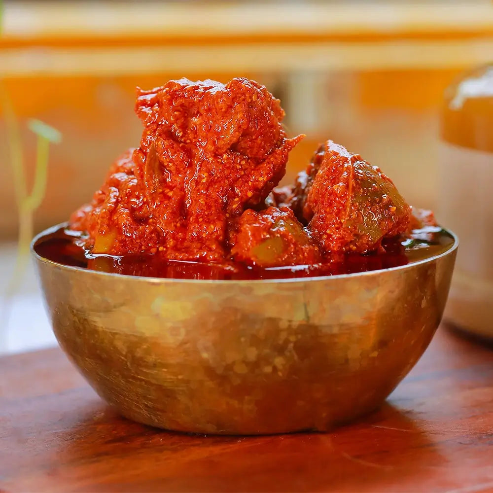 Close up shot of mango pickle in a metal bowl
