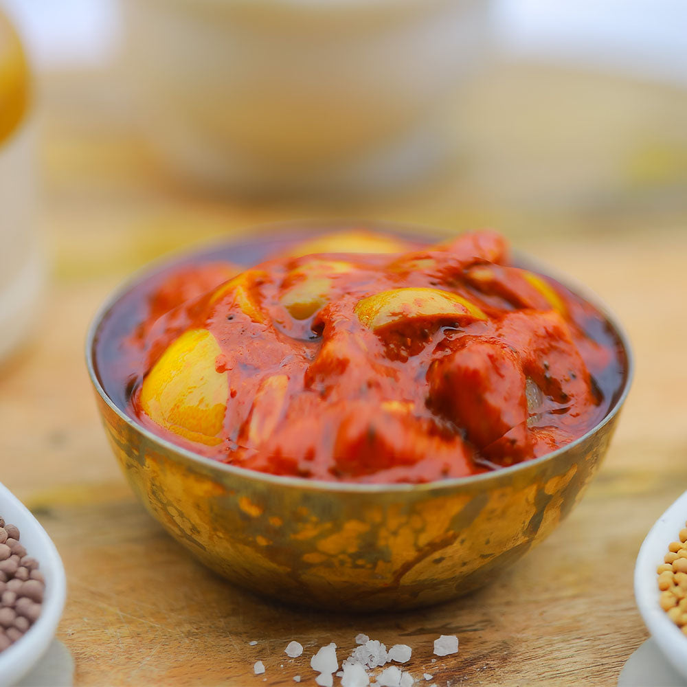 Bowl of lemon pickle on a wooden surface