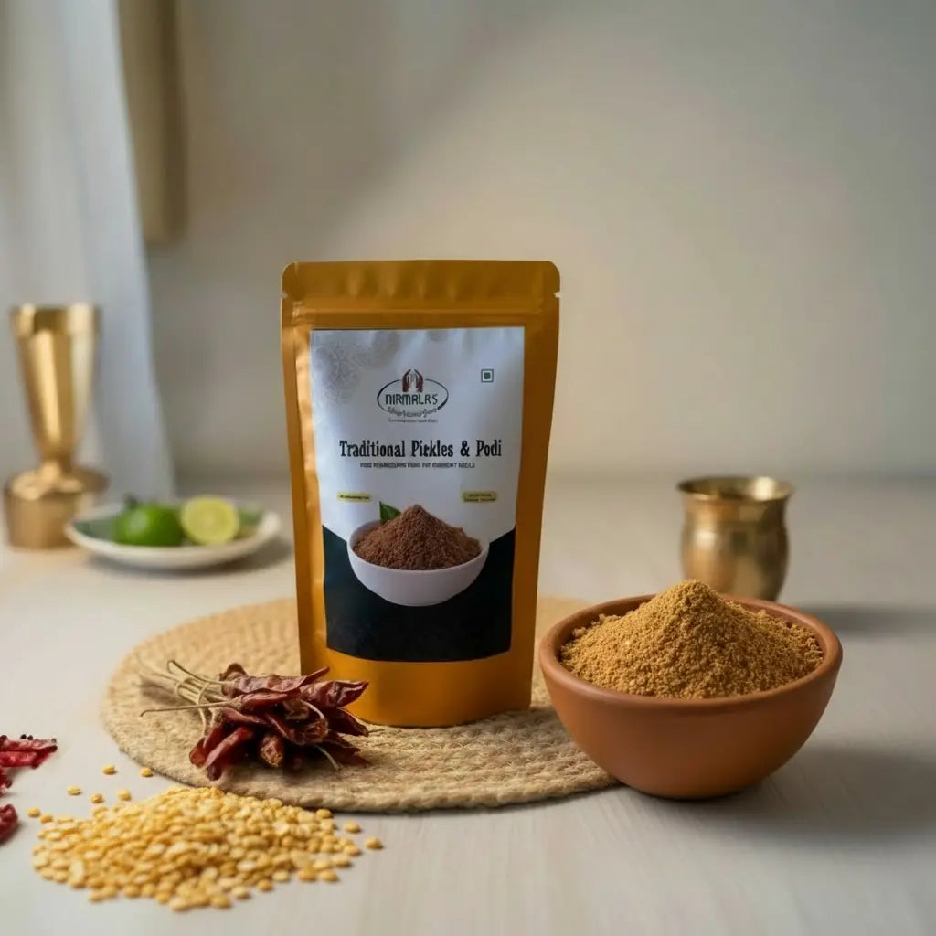 Packaged traditional kandi karam podi on a table with a bowl of powder and ingredients.