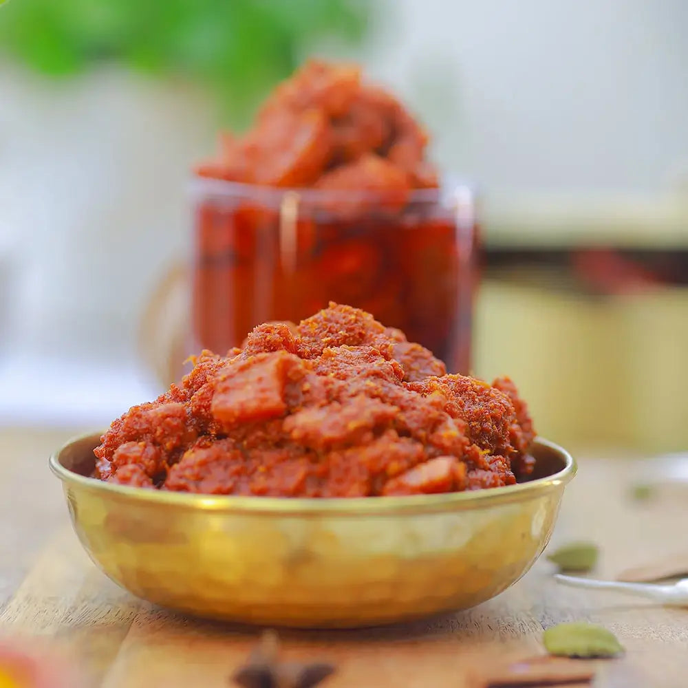 Chicken pickle in a gold bowl with a blurred background