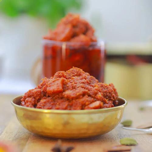 Chicken pickle in a gold bowl with a blurred background