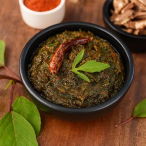 Closeup of gongura pickle showing sorrel leaves and hand-roasted spices